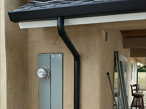 Black fascia with black round downspout, Anaheim, CA